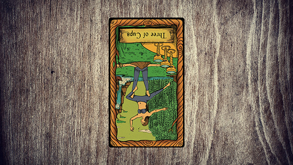 The reversed Three of Cups card signifies a lack of harmony and connection.